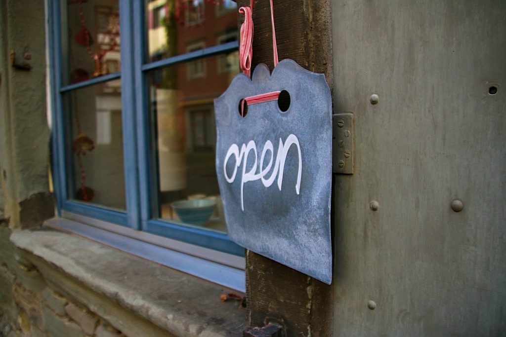 life insurance premium finance keeps businesses open. Picture of an open sign on a business